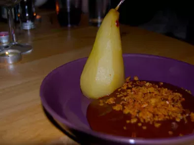 Poached Pears in a Chocolate and Baileys Custard with a Flapjack Crumble Topping.